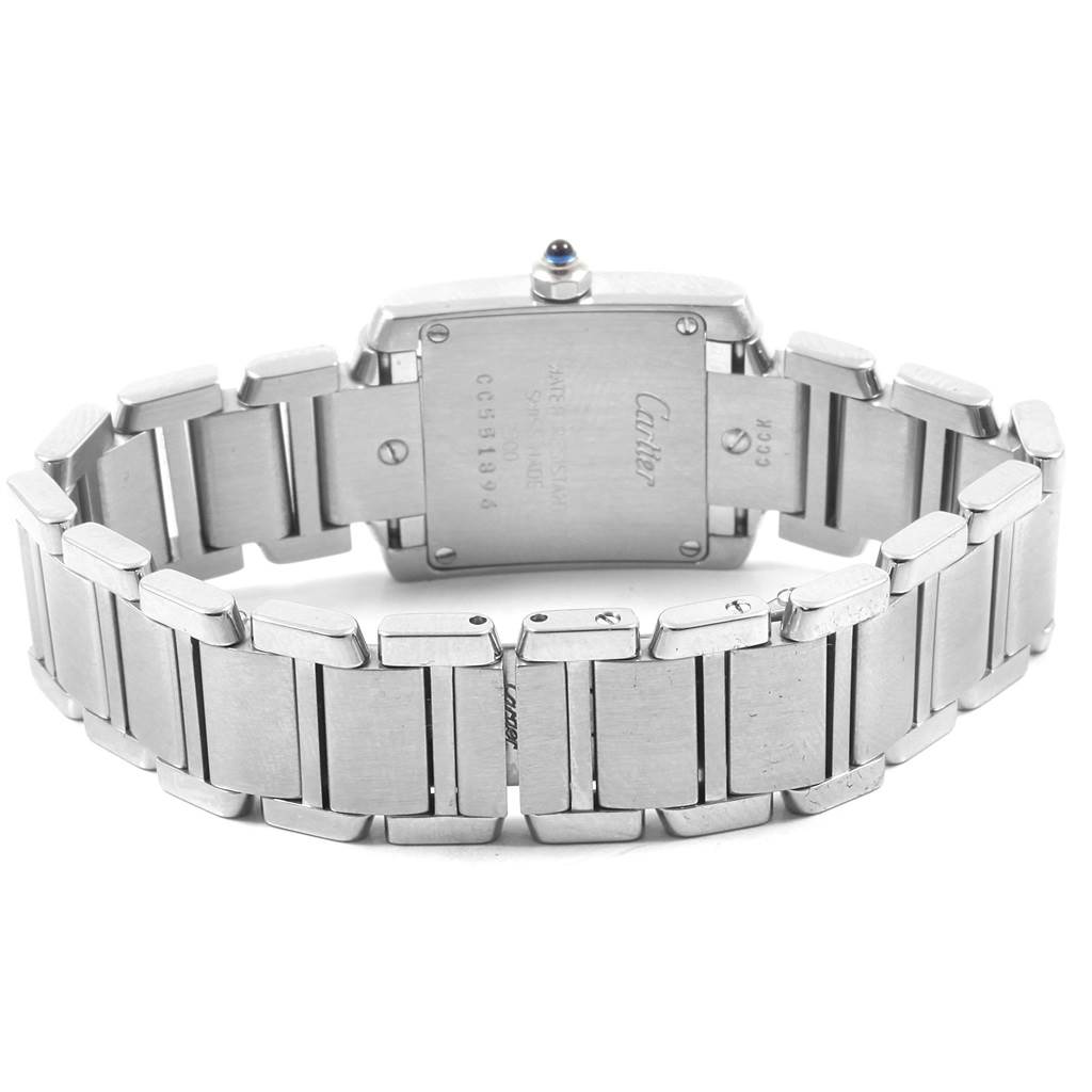 The image shows the back view of a Cartier Tank Francaise W51008Q3 Women's Stainless Steel Silver Dial W51008Q3 Women's Stainless Steel Silver Dial watch, highlighting the case back and metal bracelet.