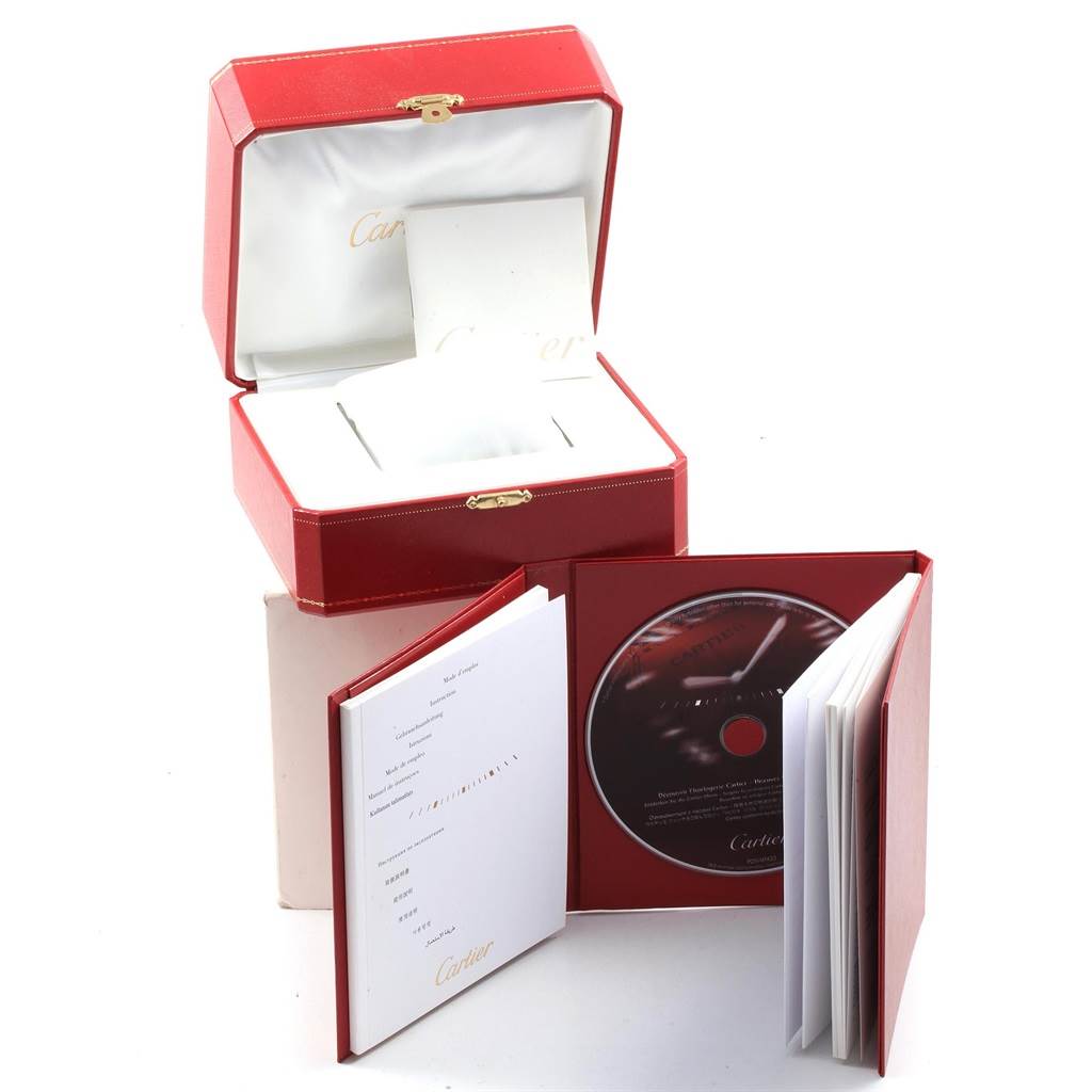 The image shows the packaging of a Cartier Tank Francaise W51008Q3 Women's Stainless Steel Silver Dial W51008Q3 Women's Stainless Steel Silver Dial watch, including a red box, a booklet, and a CD.