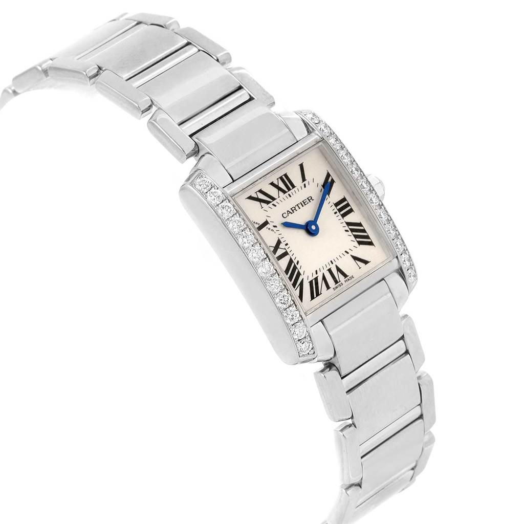 The Cartier Tank Francaise WE1002S3 Women's White Gold Silver Dial WE1002S3 Women's White Gold Silver Dial watch is shown from an angled view, highlighting its face, Roman numeral dial, and metal bracelet.