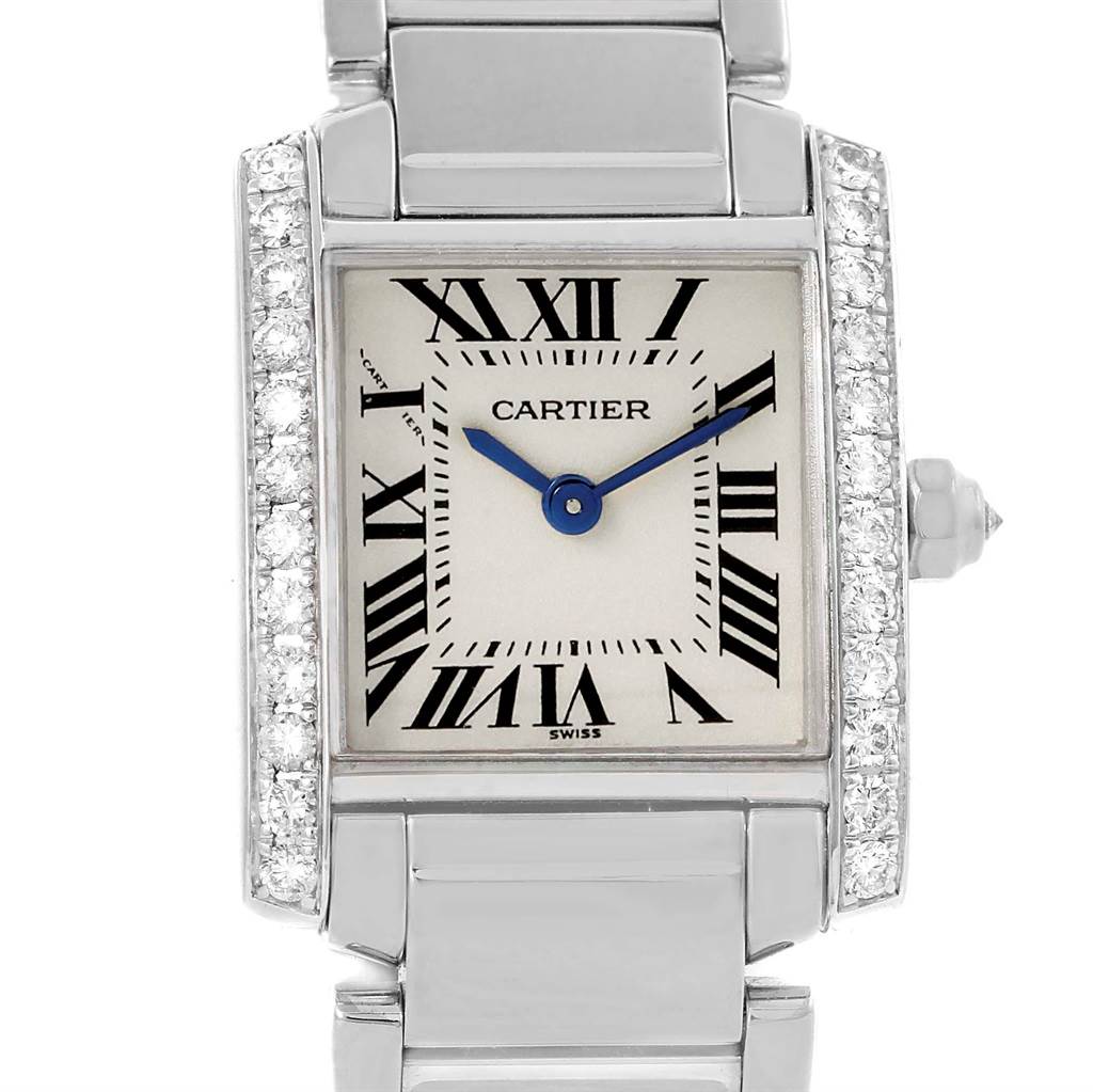 The image shows a Cartier Tank Francaise WE1002S3 Women's White Gold Silver Dial WE1002S3 Women's White Gold Silver Dial watch from a front angle, highlighting its face, roman numerals, hands, and diamond-set sides.