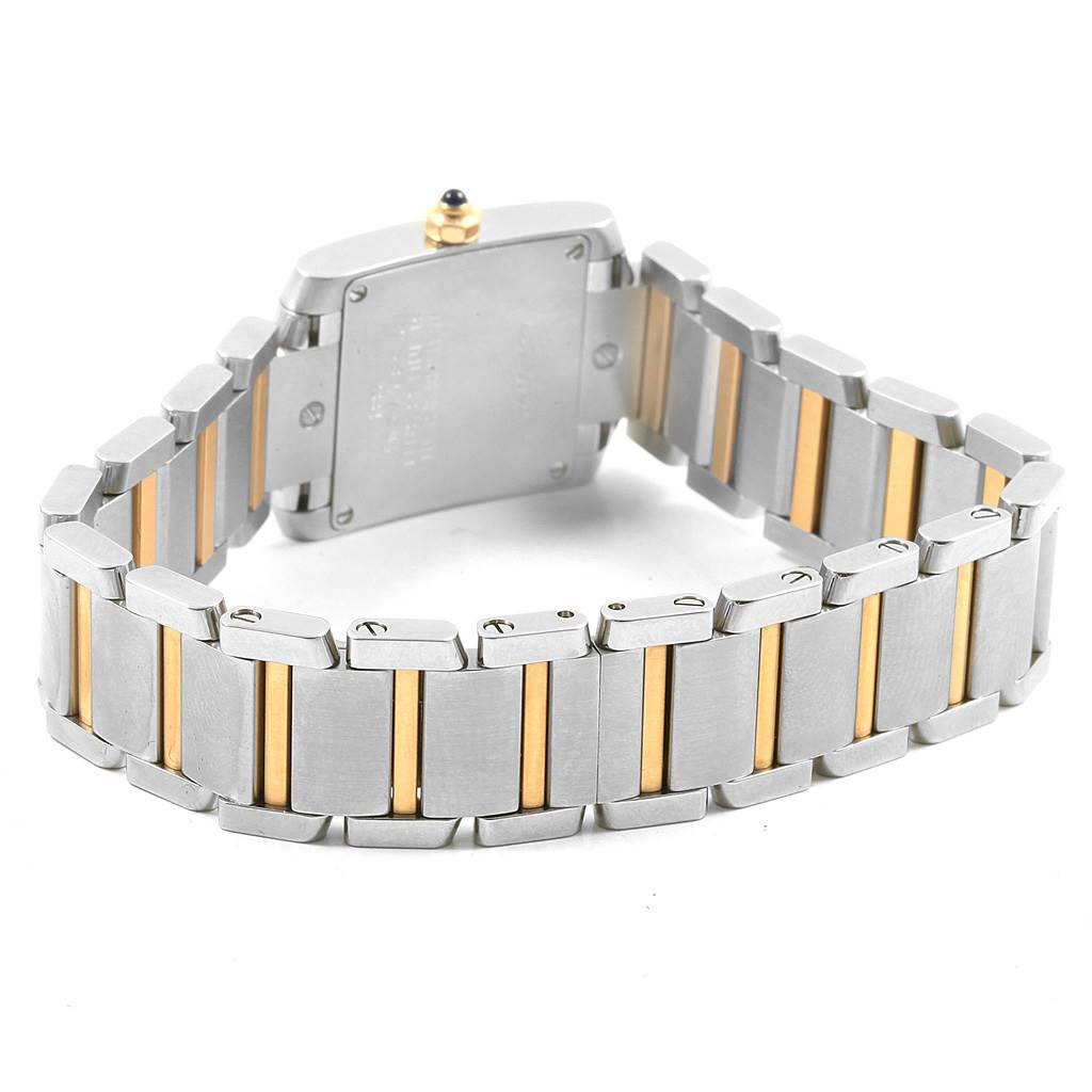 The image shows the back and bracelet of a Cartier Tank Française watch with a two-tone metal design.