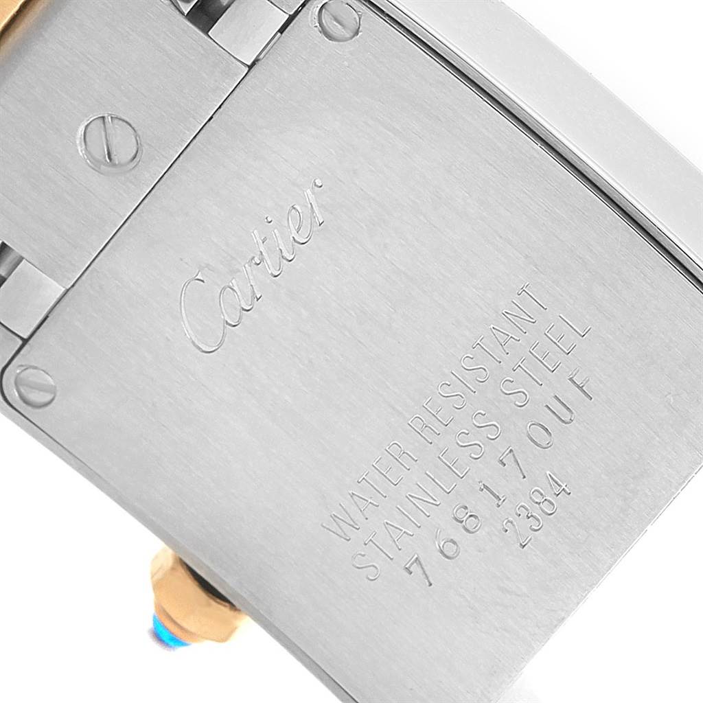 This image shows the back case of the Cartier Tank Francaise W51007Q4 Women's Steel and Gold (two tone) Silver Dial W51007Q4 Women's Steel and Gold (two tone) Silver Dial watch, highlighting the engraved brand name and specifications.