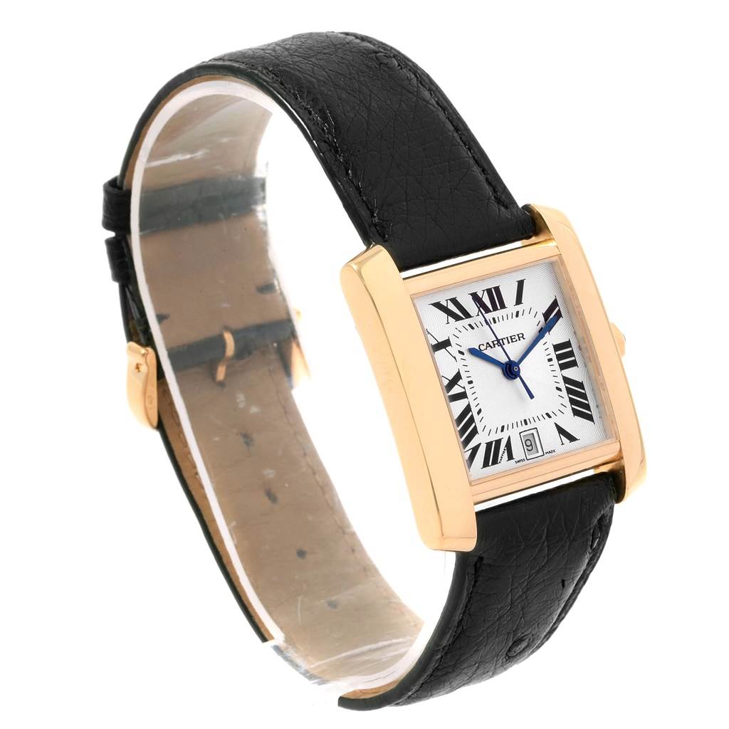 The image shows a Cartier Tank Francaise W5000156 Yellow Gold Silver Dial W5000156 Yellow Gold Silver Dial watch at a slight angle, emphasizing the black leather strap, gold rectangular case, and Roman numeral dial.