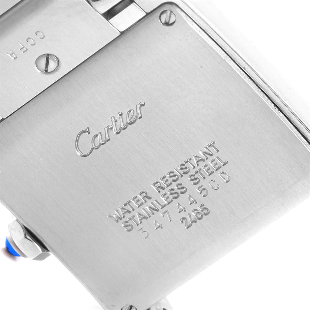 This image shows a close-up of the back case of the Cartier Tank Francaise W51011Q3 Women's Stainless Steel Silver Dial W51011Q3 Women's Stainless Steel Silver Dial watch, displaying its engraved details.