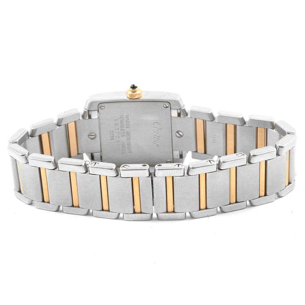 The image shows the back of the Cartier Tank Francaise W51007Q4 Women's Steel and Gold (two tone) Silver Dial W51007Q4 Women's Steel and Gold (two tone) Silver Dial watch, focusing on the two-tone metal bracelet and case back.