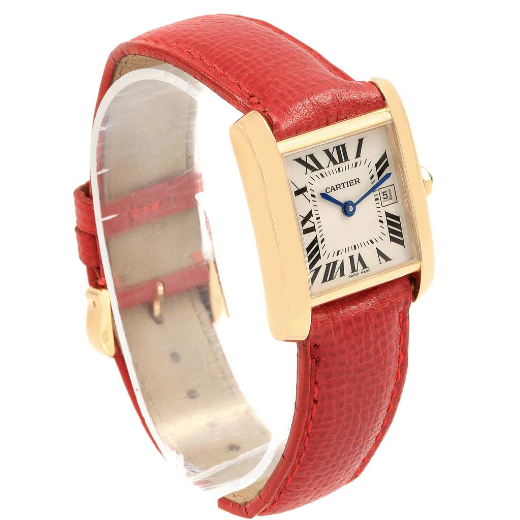 The Cartier Tank Francaise W50014N2 Women's Yellow Gold Silver Dial W50014N2 Women's Yellow Gold Silver Dial watch is shown at a three-quarter angle, highlighting its red strap, gold case, and rectangular dial.