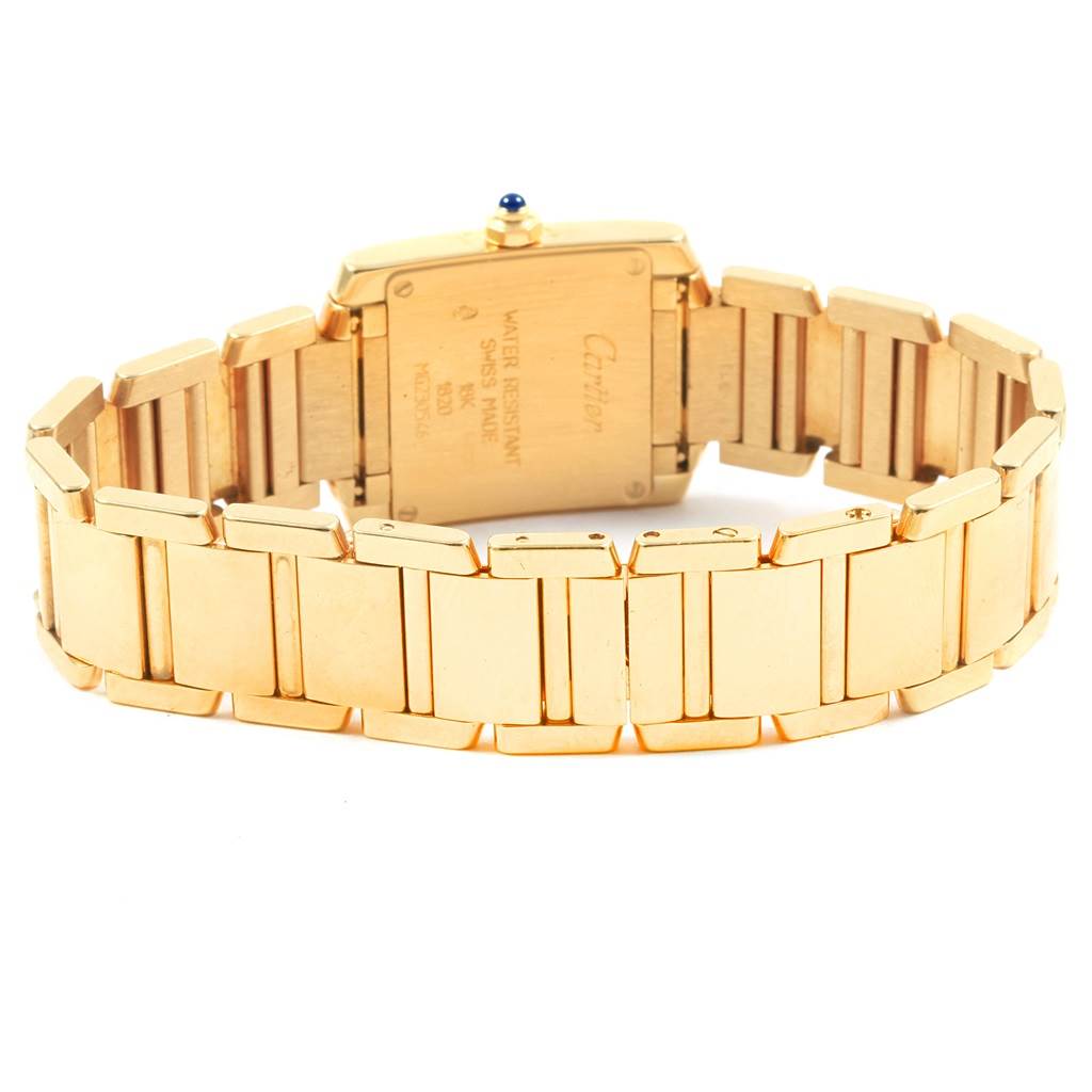 This image shows the back view of a Cartier Tank Francaise W50002N2 Women's Yellow Gold Silver Dial W50002N2 Women's Yellow Gold Silver Dial watch, highlighting the gold bracelet and case back.