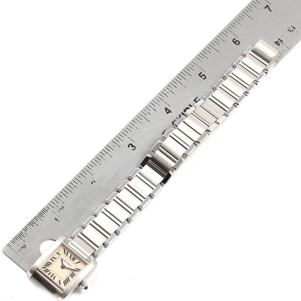 The Cartier Tank Francaise W51008Q3 Women
s Stainless Steel Silver Dial W51008Q3 Women
s Stainless Steel Silver Dial watch is shown from a top-down angle, next to a ruler for size reference.