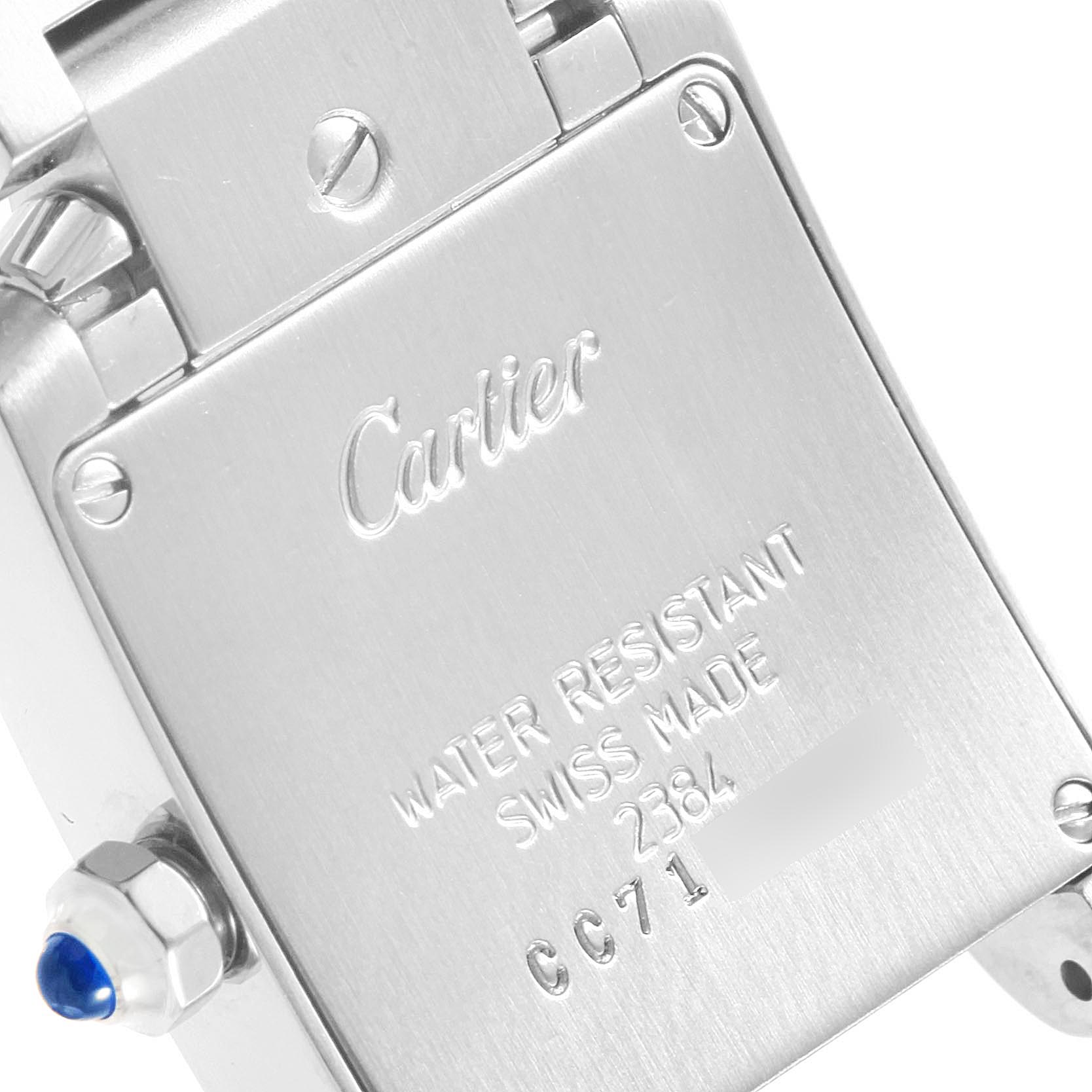 The image shows the back of a Cartier Tank Francaise W51008Q3 Women's Stainless Steel Silver Dial W51008Q3 Women's Stainless Steel Silver Dial watch, highlighting the branding, water resistance, and Swiss origin.