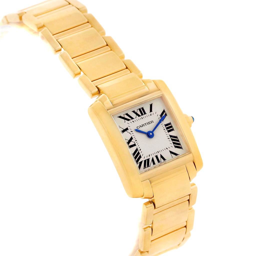 This image shows a Cartier Tank Francaise W50002N2 Women's Yellow Gold Silver Dial W50002N2 Women's Yellow Gold Silver Dial watch from an angled top-down view, highlighting both the face and gold bracelet.