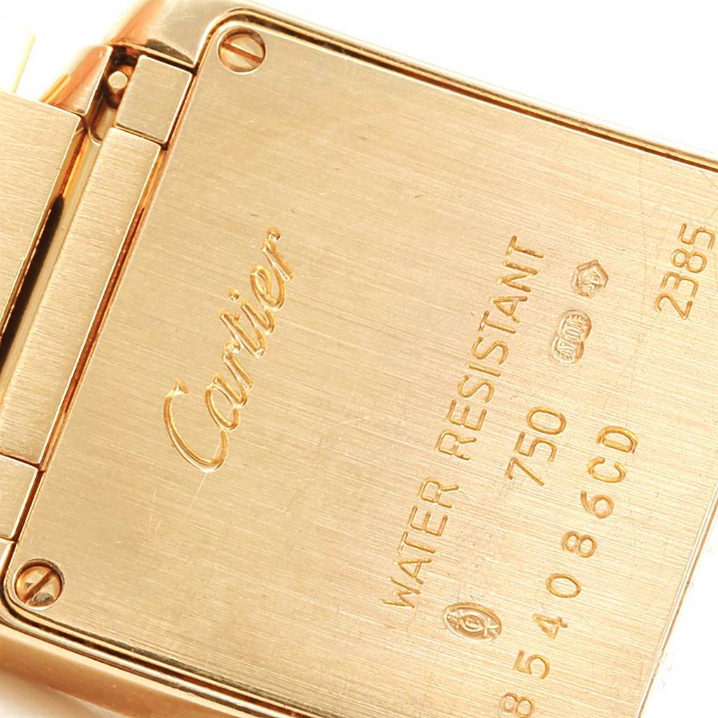 The image shows the backside of the Cartier Tank Francaise W50002N2 Women's Yellow Gold Silver Dial W50002N2 Women's Yellow Gold Silver Dial watch, highlighting the engravings on the case.