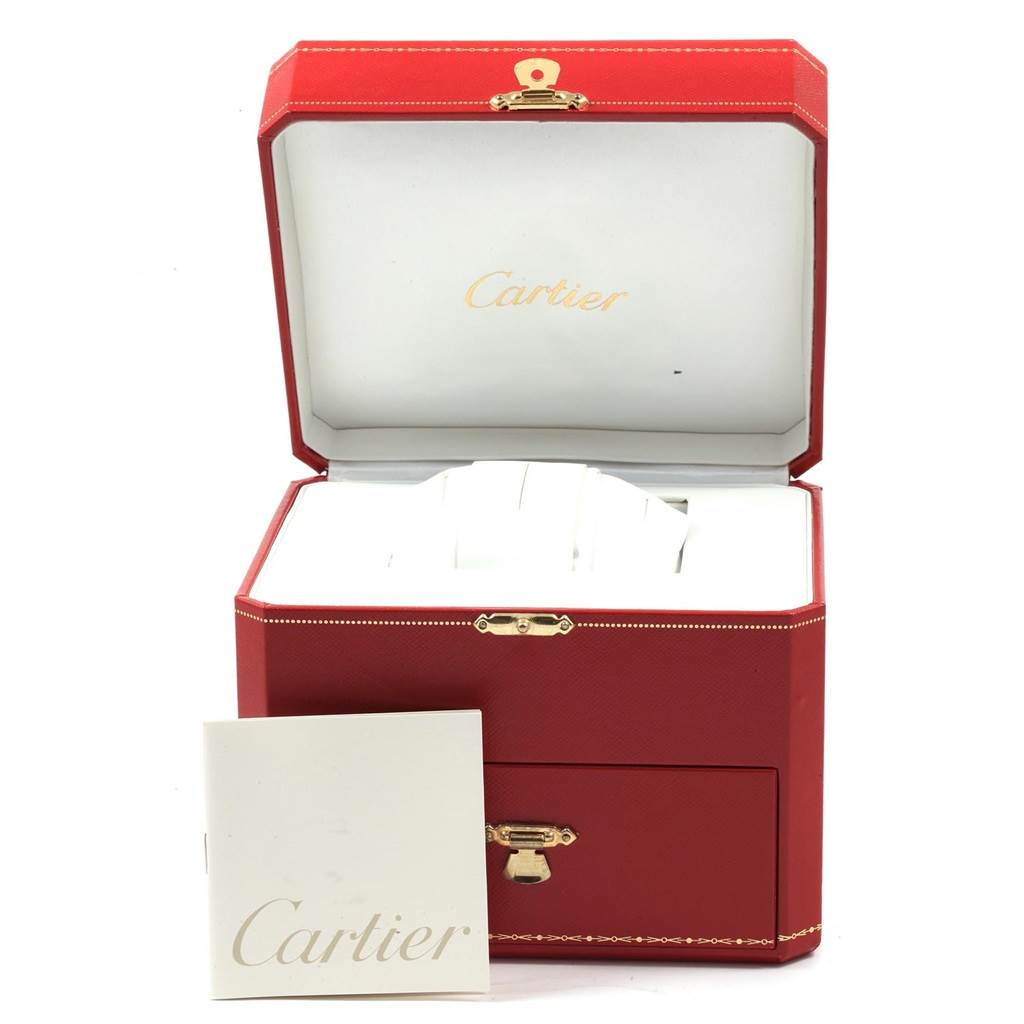 The image shows the Cartier Tank Française watch case, booklet, and interior packaging from a front angle.