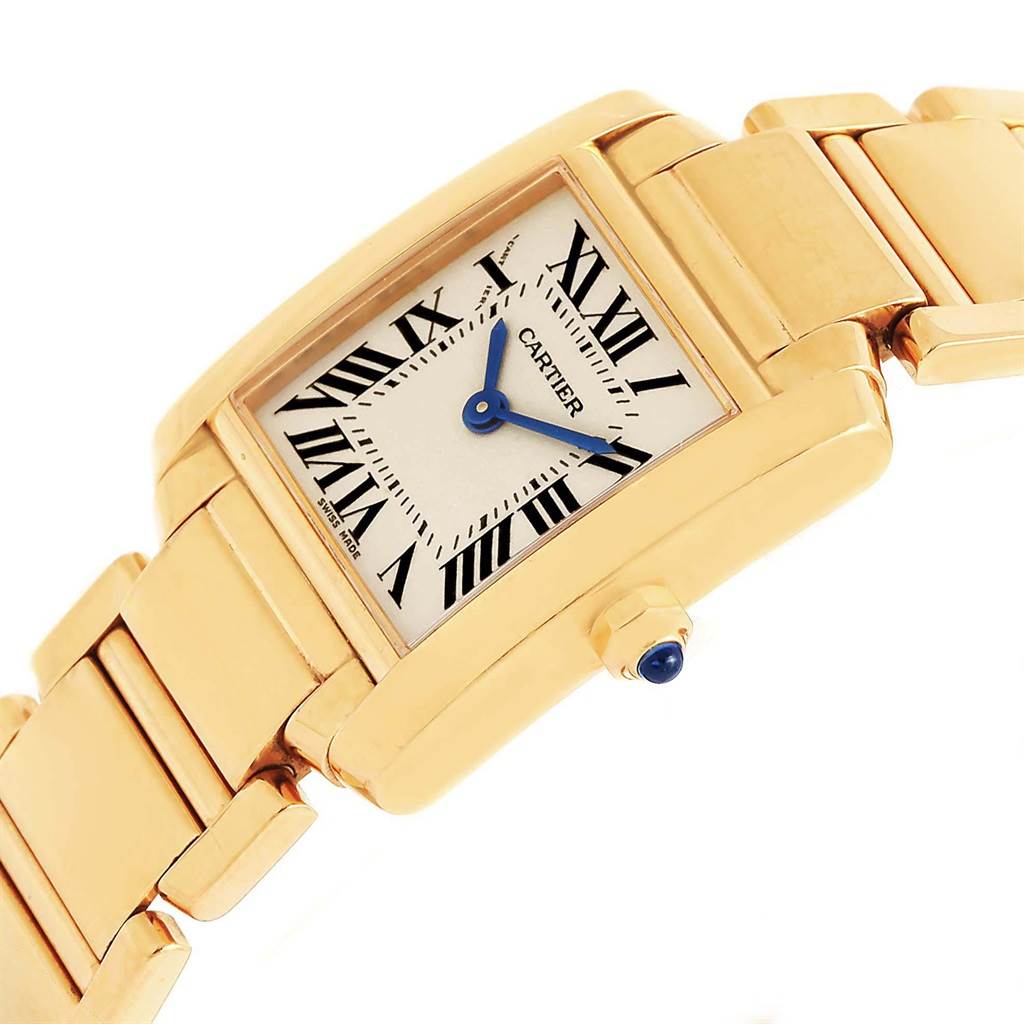 The Cartier Tank Francaise W50002N2 Women's Yellow Gold Silver Dial W50002N2 Women's Yellow Gold Silver Dial watch is shown at an angle highlighting the face, bezel, crown, and bracelet.