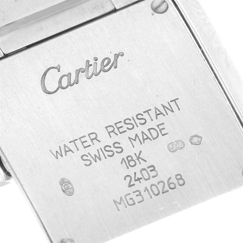 This image shows the back case of a Cartier Tank Francaise WE1002S3 Women's White Gold Silver Dial WE1002S3 Women's White Gold Silver Dial watch, highlighting its engravings and markings.