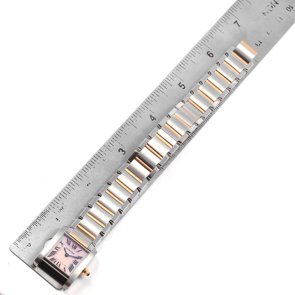The image shows a Cartier Tank Francaise W51027Q4 Women's Steel and Gold (two tone) Mother of Pearl Dial W51027Q4 Women's Steel and Gold (two tone) Mother of Pearl Dial watch with a partial view of the case and bracelet aligned next to a ruler.