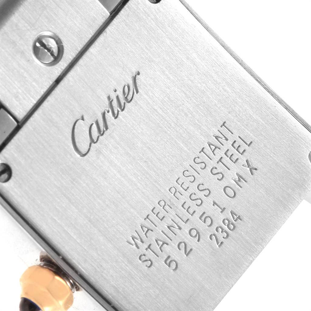 The image shows the back case of the Cartier Tank Francaise W51007Q4 Women's Steel and Gold (two tone) Silver Dial W51007Q4 Women's Steel and Gold (two tone) Silver Dial watch, highlighting the engraved brand and model information.