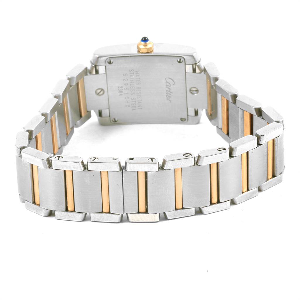 The image shows the back of a Cartier Tank Francaise W51007Q4 Women's Steel and Gold (two tone) Silver Dial W51007Q4 Women's Steel and Gold (two tone) Silver Dial watch, highlighting the case back and two-tone bracelet at an angled view.