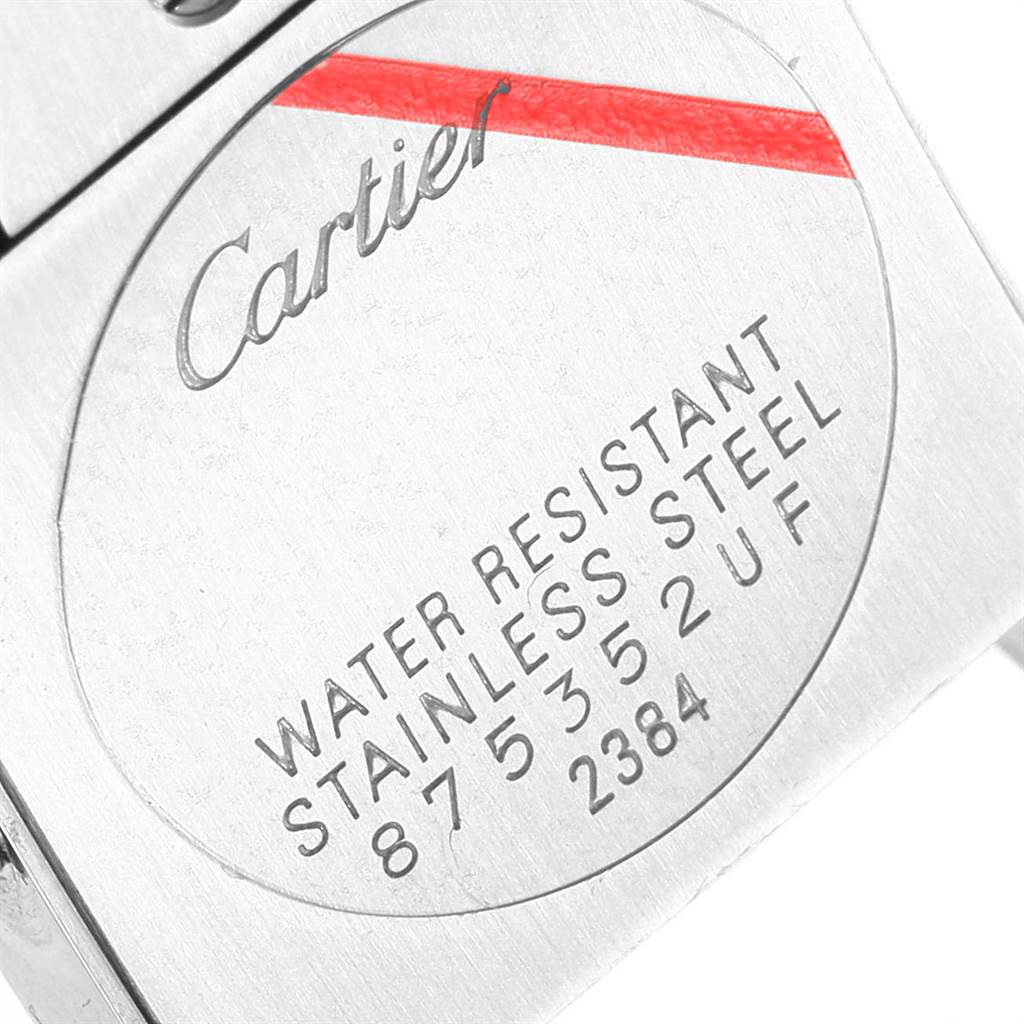 The image shows the back case of the Cartier Tank Francaise W51007Q4 Women's Steel and Gold (two tone) Silver Dial W51007Q4 Women's Steel and Gold (two tone) Silver Dial watch with engraved details about its water resistance and material.