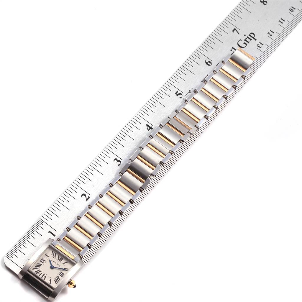 The image shows the face and bracelet of a Cartier Tank Francaise W51007Q4 Women's Steel and Gold (two tone) Silver Dial W51007Q4 Women's Steel and Gold (two tone) Silver Dial watch, measured against a ruler.