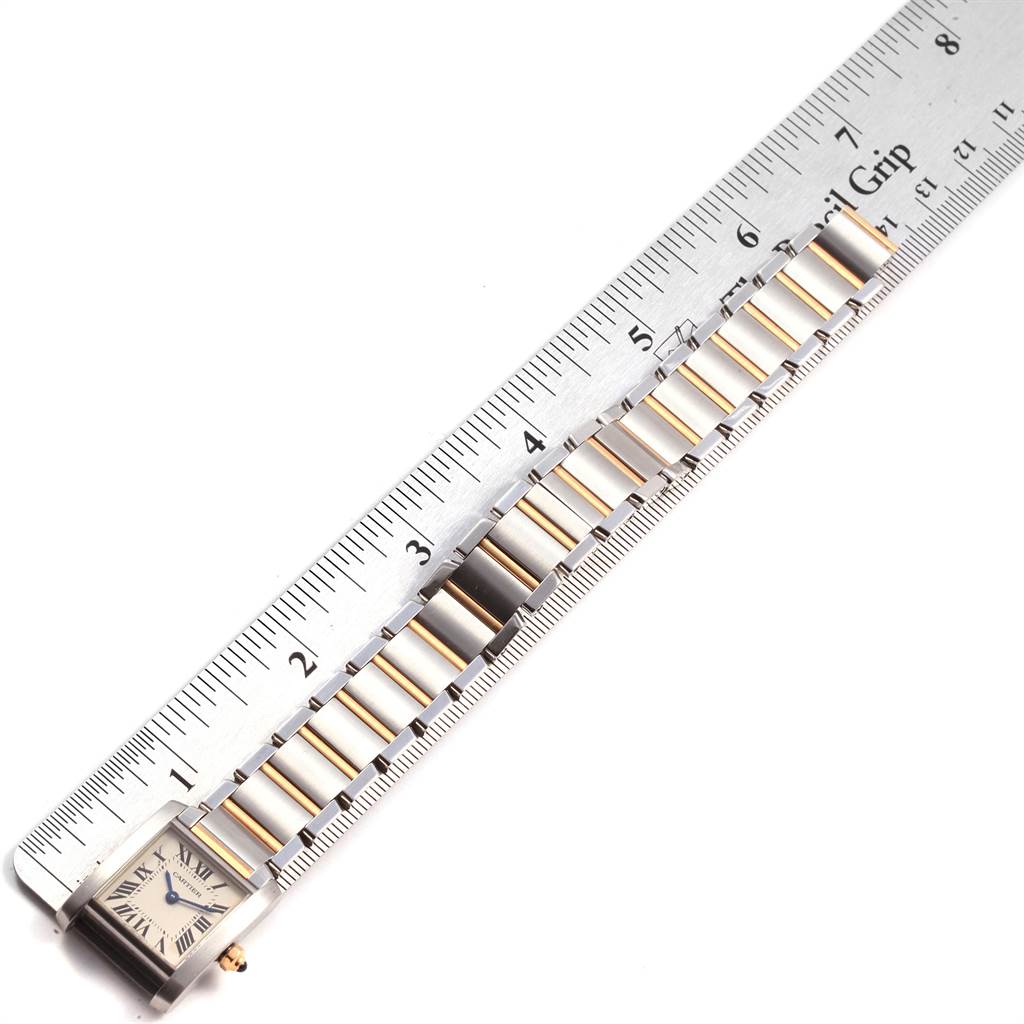 The Cartier Tank Francaise W51007Q4 Women's Steel and Gold (two tone) Silver Dial W51007Q4 Women's Steel and Gold (two tone) Silver Dial watch is shown from the top view, displaying the face and part of the metal strap alongside a ruler for scale.