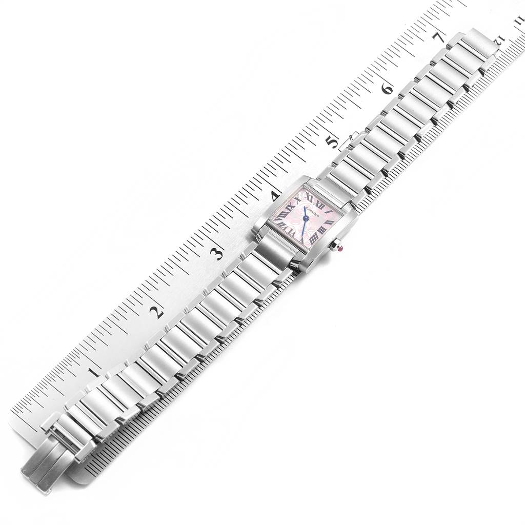 The Cartier Tank Francaise W51031Q3 Women's Stainless Steel Silver Dial W51031Q3 Women's Stainless Steel Silver Dial watch is shown flat with its metal band fully extended on a ruler, highlighting the size and design.