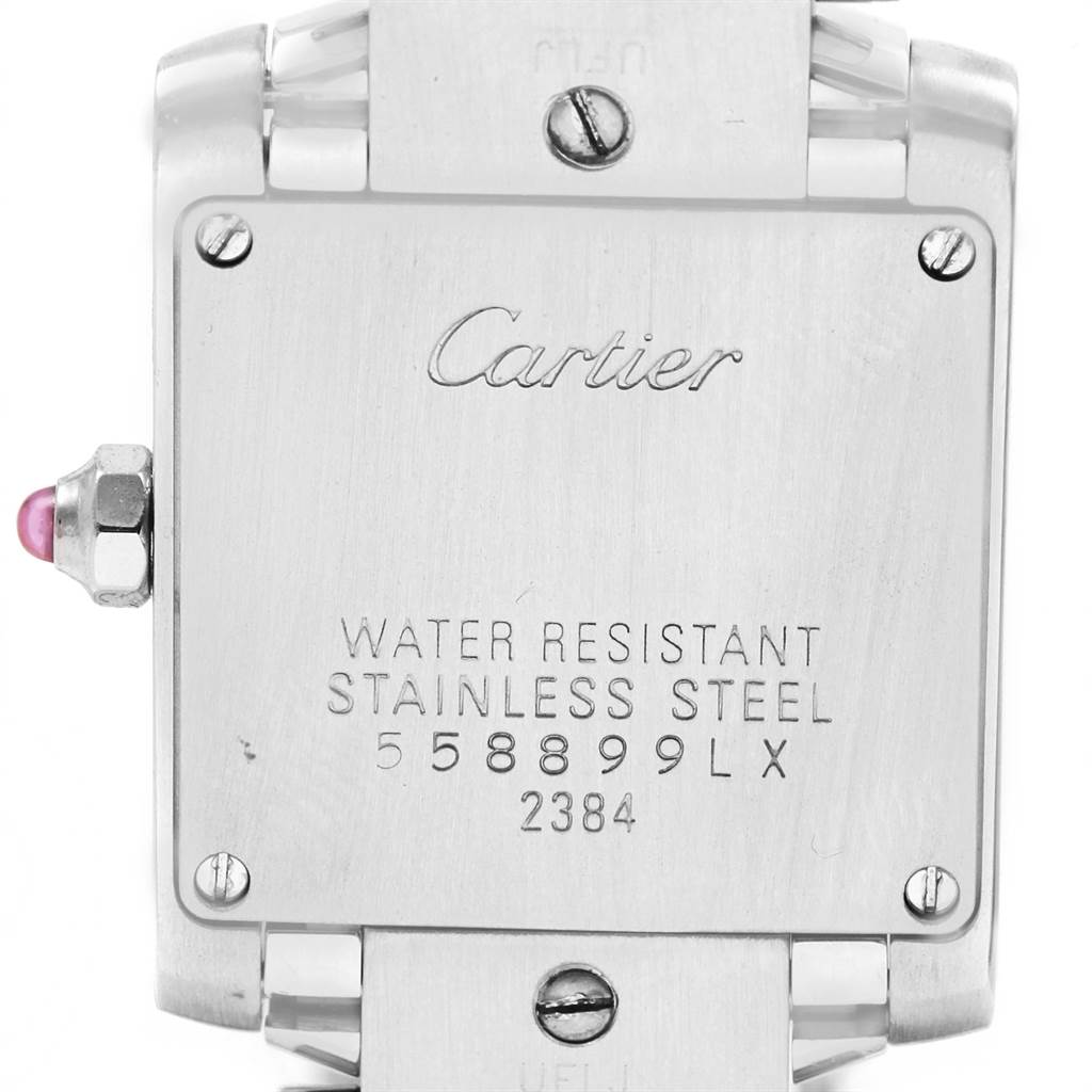 This image shows the back of a Cartier Tank Francaise W51031Q3 Women's Stainless Steel Silver Dial W51031Q3 Women's Stainless Steel Silver Dial watch, featuring engravings and the stainless steel case.