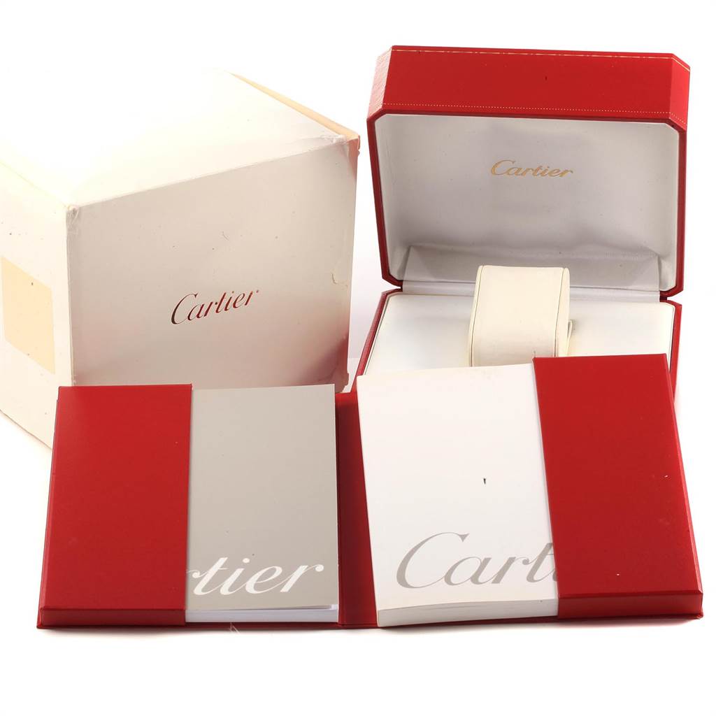 The image shows the packaging of Cartier's Tank Francaise model, including the red box, outer white box, and accompanying booklets.
