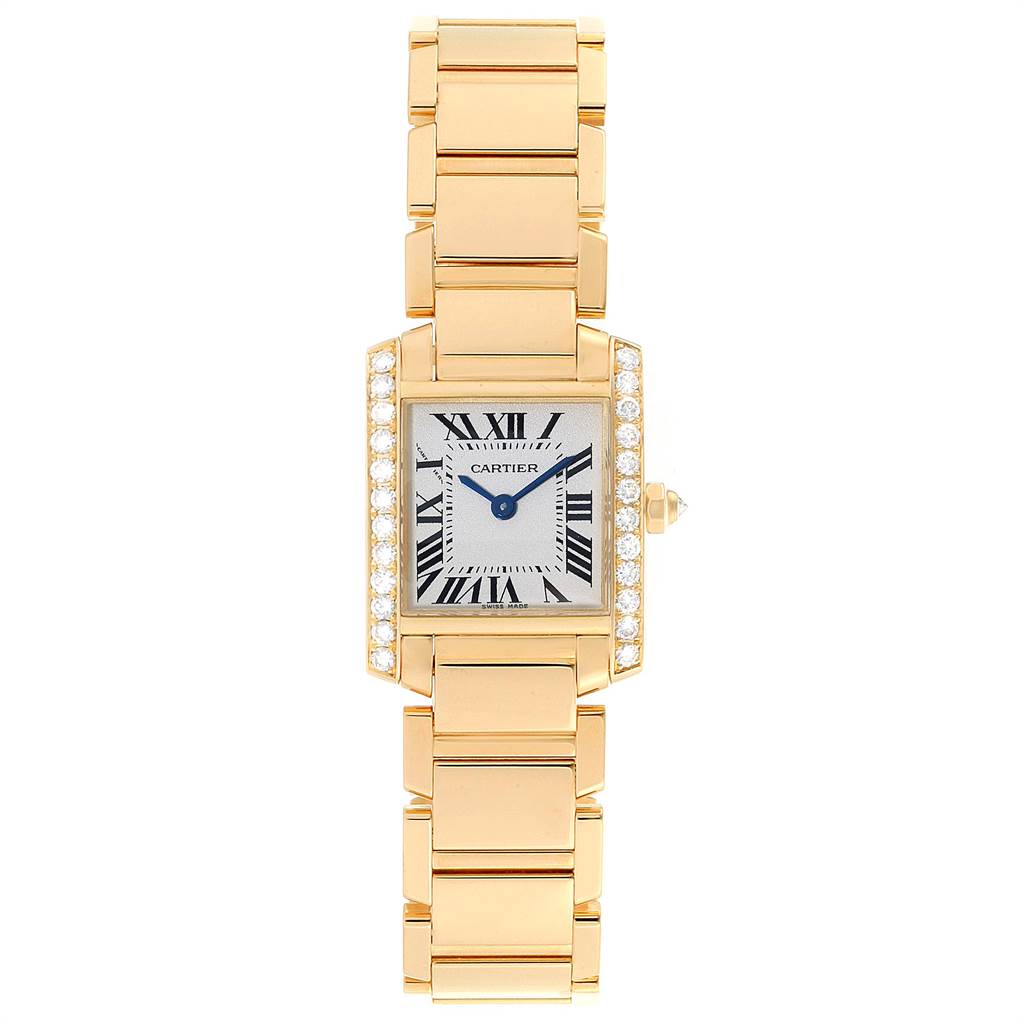 The Tank Francaise by Cartier is shown from a top-down angle, displaying its rectangular face, gold bracelet, and diamond-accented bezel.