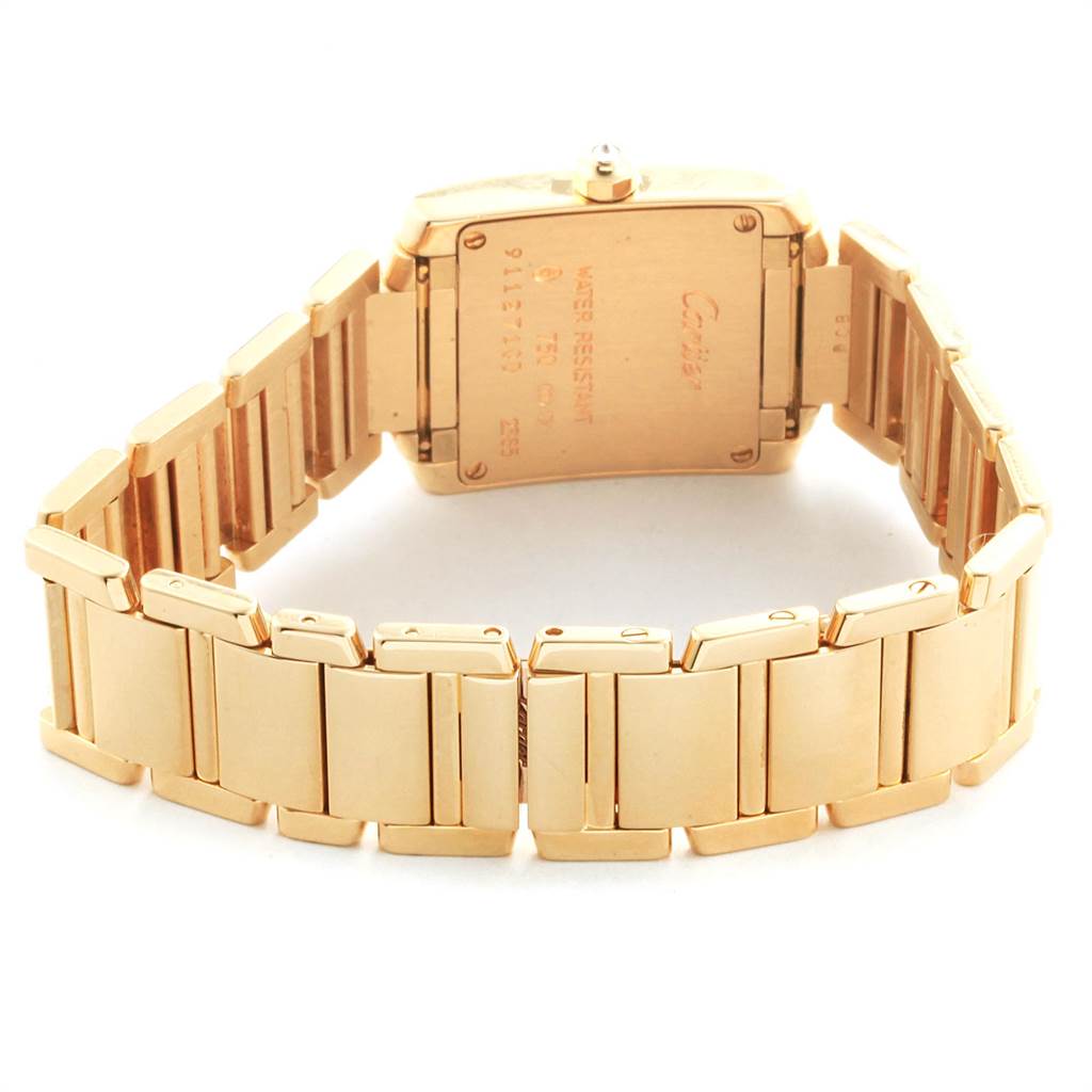 The image shows the back view of a Cartier Tank Française watch, highlighting the watch's case back and the metal link bracelet.