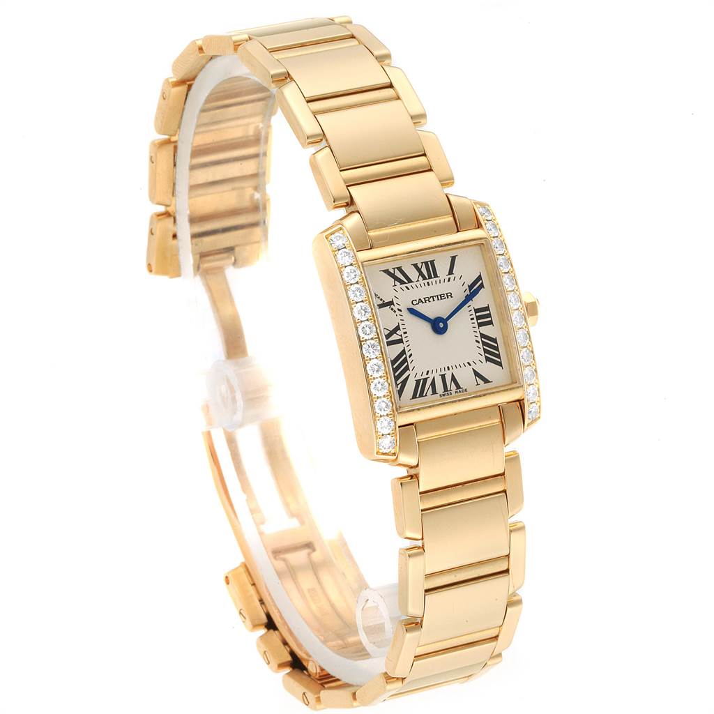 The Cartier Tank Francaise WE1001R8 Women's Yellow Gold Silver Dial WE1001R8 Women's Yellow Gold Silver Dial watch is shown at a slight angle, highlighting its rectangular face, gold band, and diamond accents.