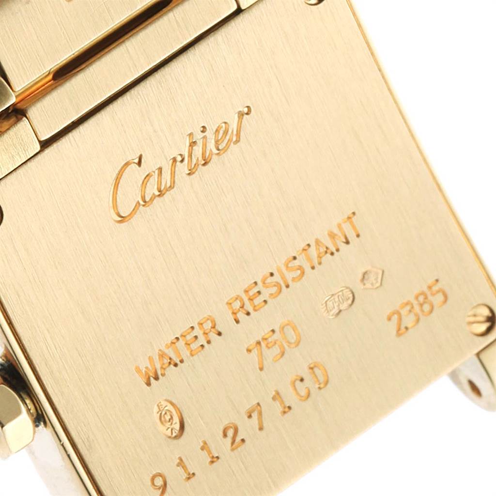 The image shows the back of a Cartier Tank Francaise WE1001R8 Women's Yellow Gold Silver Dial WE1001R8 Women's Yellow Gold Silver Dial watch, highlighting engravings and water resistance information.