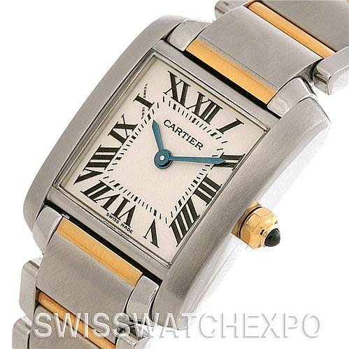 This image shows a close-up of the Cartier Tank Francaise W51007Q4 Women's Yellow Gold Silver Dial W51007Q4 Women's Yellow Gold Silver Dial watch face, showcasing its dial, Roman numerals, blue hands, crown, and part of the metal bracelet.