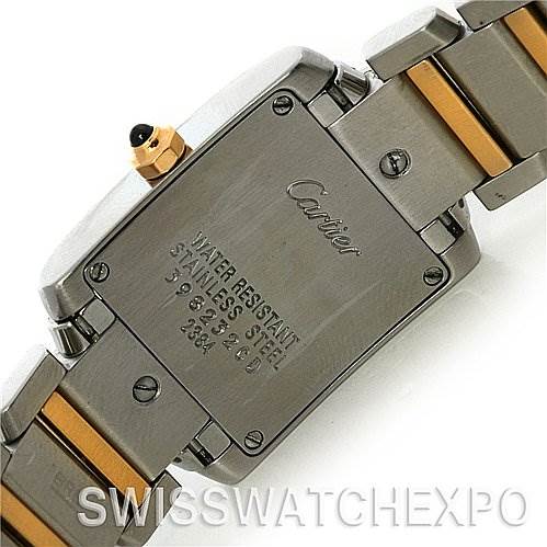 The image shows the back case and part of the metal bracelet of a Cartier Tank Francaise W51007Q4 Women's Yellow Gold Silver Dial W51007Q4 Women's Yellow Gold Silver Dial watch.