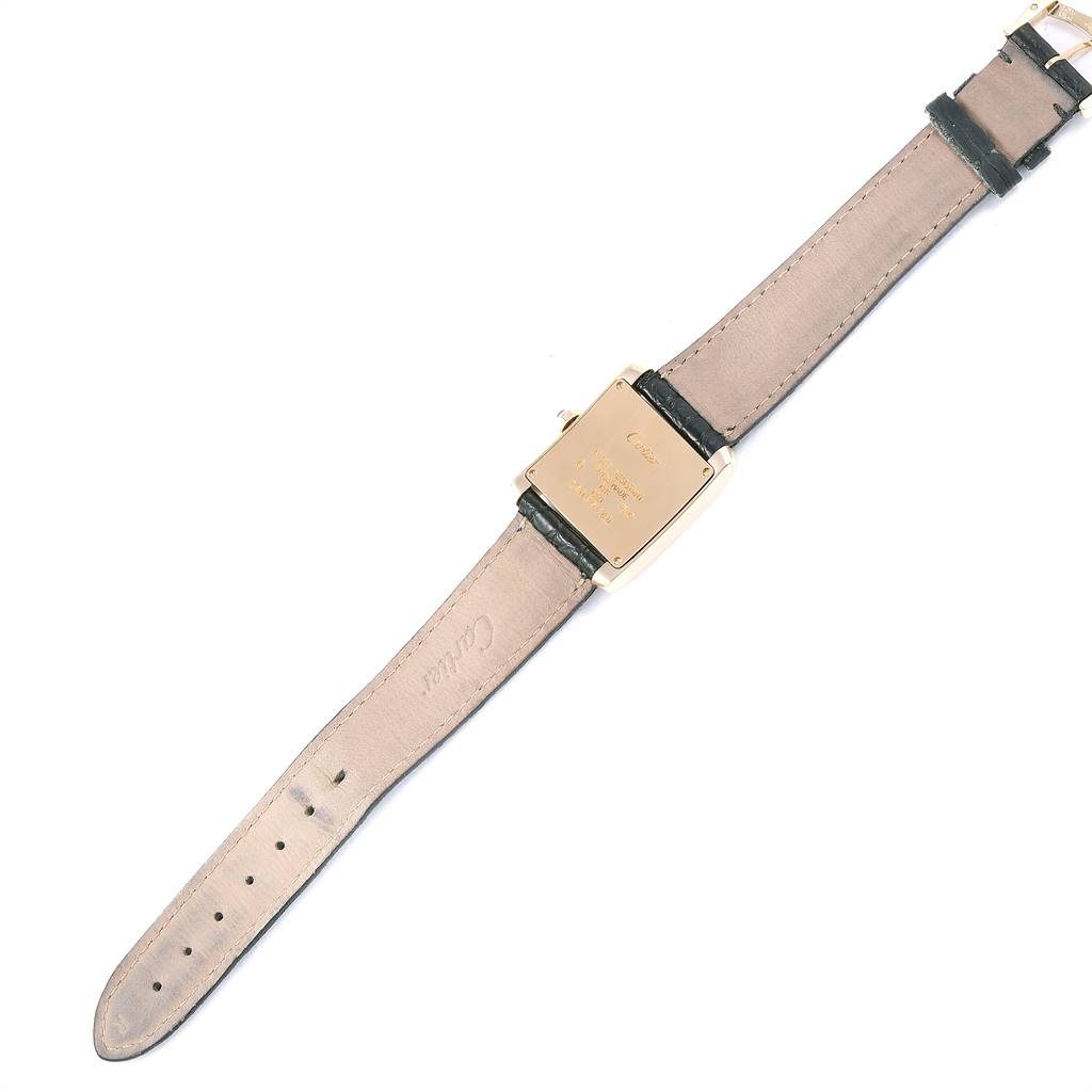 The image shows the back view of a Cartier Tank Francaise W50003N2 Women's Yellow Gold Silver Dial W50003N2 Women's Yellow Gold Silver Dial watch, highlighting its case back and leather straps.