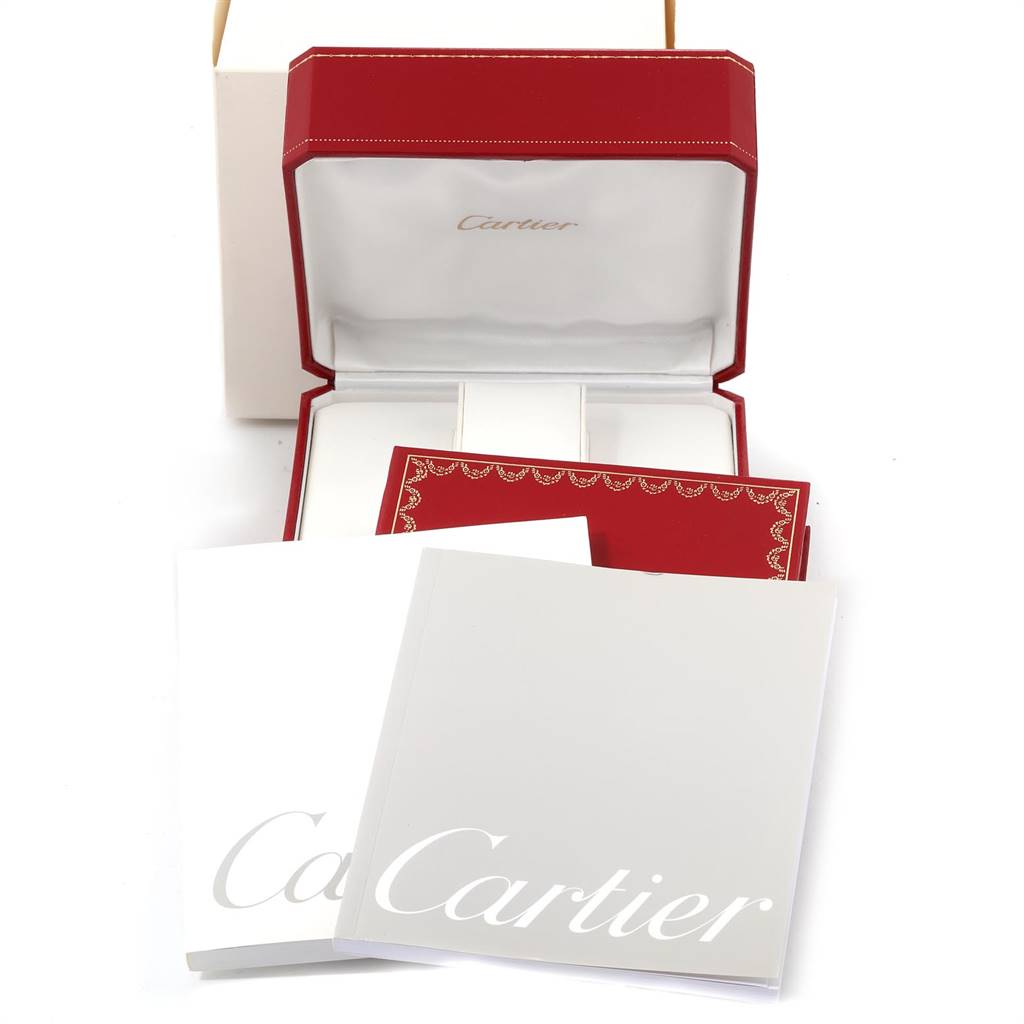 The image displays the packaging and documentation for a Cartier Tank Francaise W50003N2 Women's Yellow Gold Silver Dial W50003N2 Women's Yellow Gold Silver Dial watch, including the box and manuals.