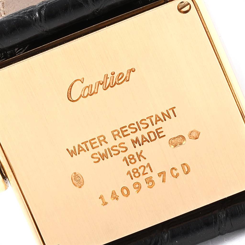 The image shows the back case of a Cartier Tank Francaise W50003N2 Women's Yellow Gold Silver Dial W50003N2 Women's Yellow Gold Silver Dial watch, highlighting the brand name, water resistance, and material details.