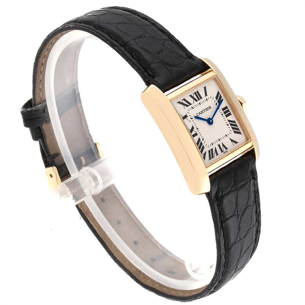 The image shows a Cartier Tank Francaise W50003N2 Women's Yellow Gold Silver Dial W50003N2 Women's Yellow Gold Silver Dial watch at an angle highlighting its rectangular dial, gold case, and black leather strap.