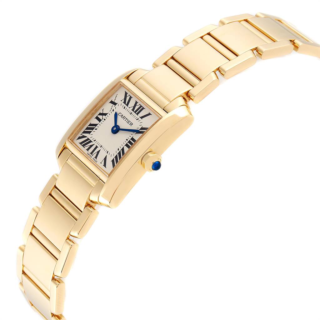The image shows a side angle of a Cartier Tank Francaise W50002N2 Women's Yellow Gold Silver Dial W50002N2 Women's Yellow Gold Silver Dial watch, highlighting the gold bracelet, rectangular case, and blue cabochon crown.