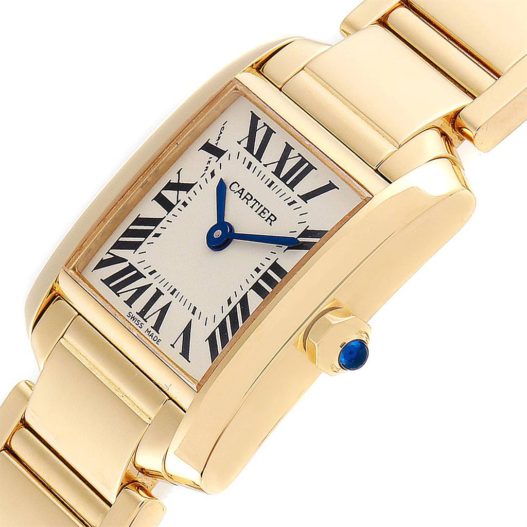 The image shows a close-up angled view of the Cartier Tank Francaise W50002N2 Women's Yellow Gold Silver Dial W50002N2 Women's Yellow Gold Silver Dial watch, featuring its dial, blue hands, and part of the bracelet.