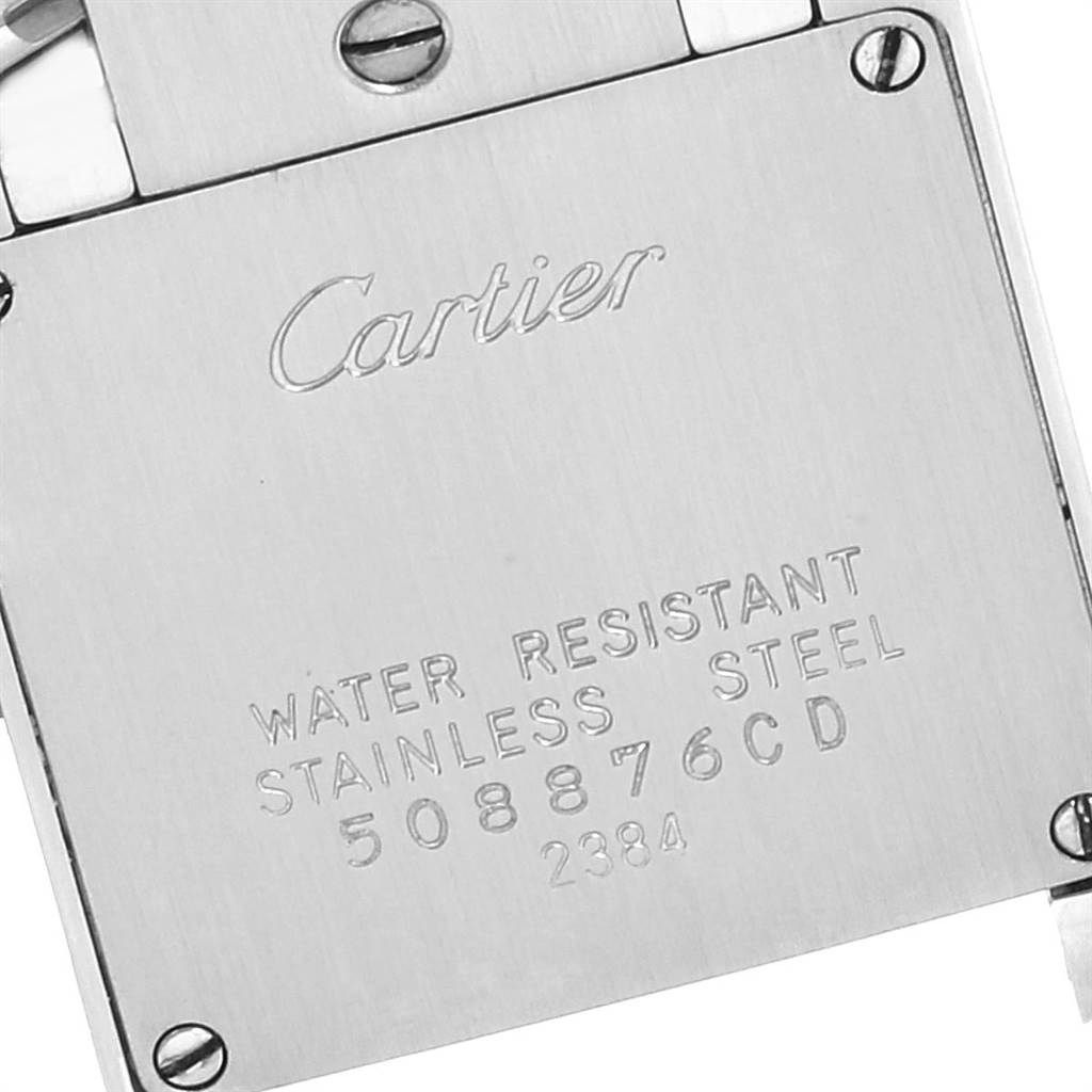 The image shows the back case of a Cartier Tank Francaise W51007Q4 Women's Steel and Gold (two tone) Silver Dial W51007Q4 Women's Steel and Gold (two tone) Silver Dial watch with inscriptions and screws visible.