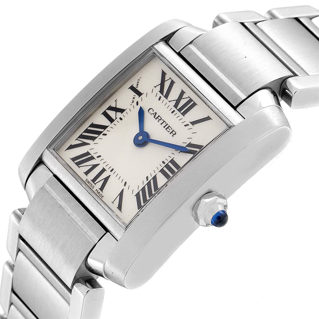 This image shows a tilted angle of the Cartier Tank Francaise W51008Q3 Women's Stainless Steel Silver Dial W51008Q3 Women's Stainless Steel Silver Dial watch, highlighting the face, bracelet, and crown with a blue gem.