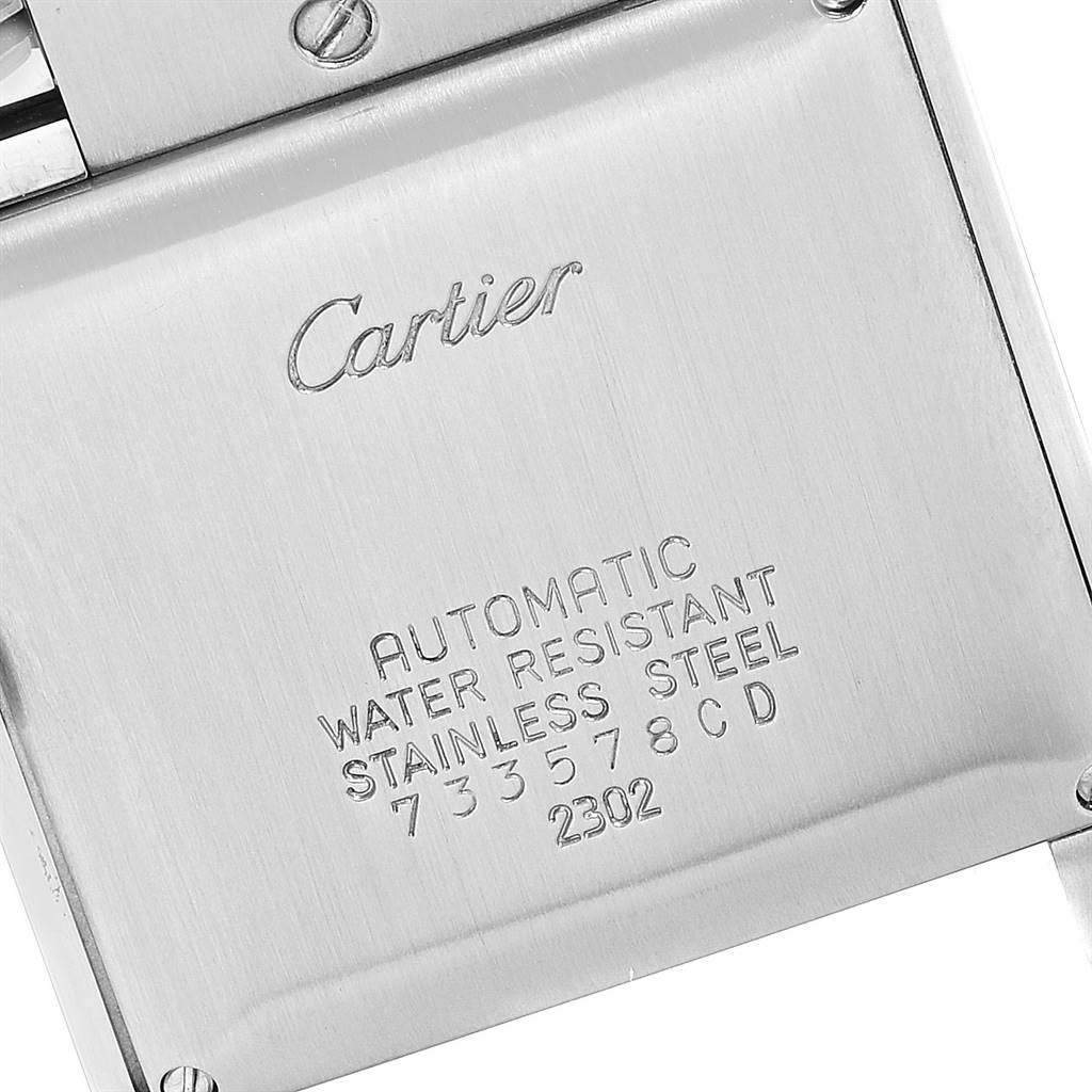 This image shows the back case of a Cartier Tank Francaise W51005Q4 Men's Steel and Gold (two tone) Silver Dial W51005Q4 Men's Steel and Gold (two tone) Silver Dial watch, highlighting its material, water resistance, and serial number.
