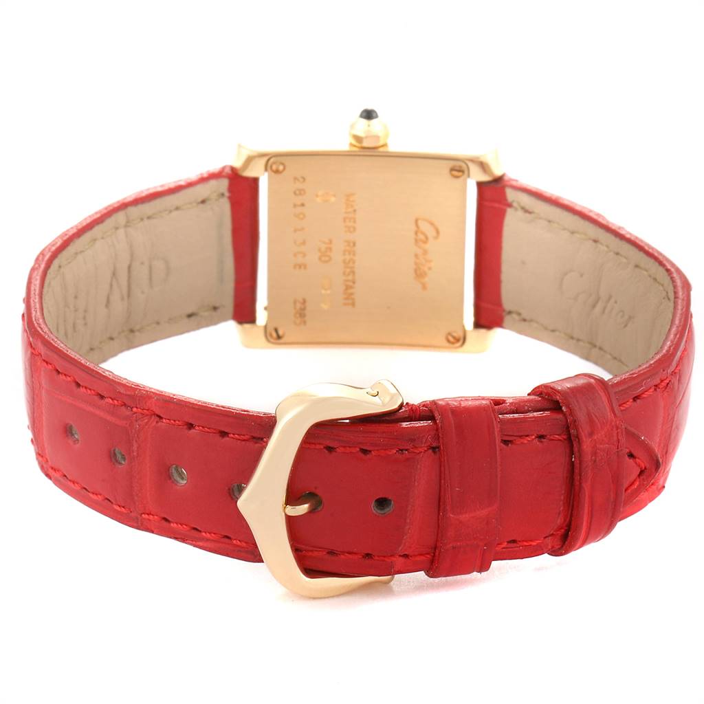 The image shows the back view of a Cartier Tank Francaise W5000256 Women's Yellow Gold Silver Dial W5000256 Women's Yellow Gold Silver Dial watch, highlighting the red leather strap and gold buckle.