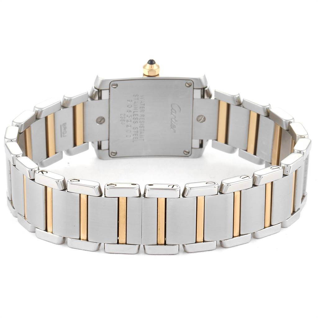 The image shows the back view of a Cartier Tank Française watch, highlighting its bracelet and case back.