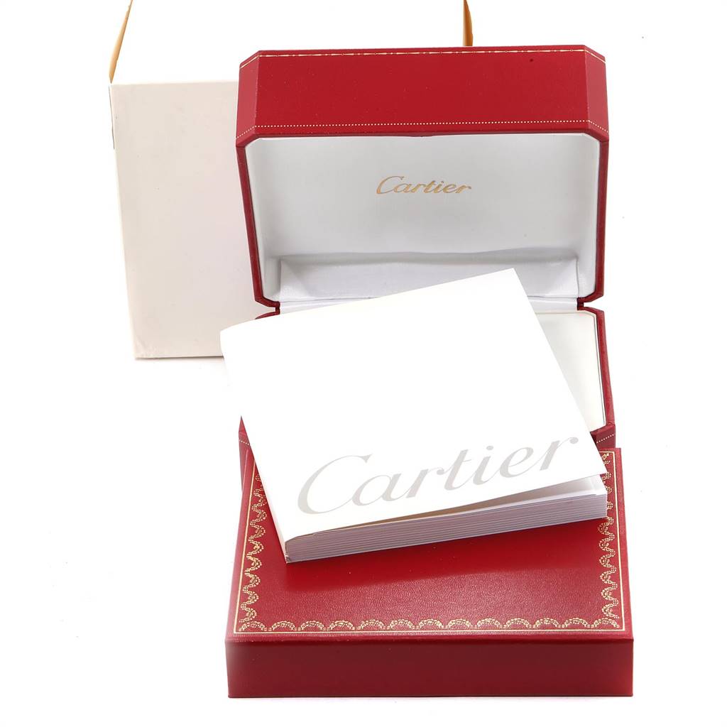 The image shows the open red box of a Cartier Tank Francaise W5010001 Women's Steel and Gold (two tone) Black Dial W5010001 Women's Steel and Gold (two tone) Black Dial watch, along with its white booklet.