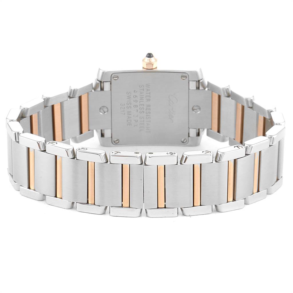 The image shows the back of the Cartier Tank Française watch, highlighting its case back and two-tone stainless steel and gold bracelet.