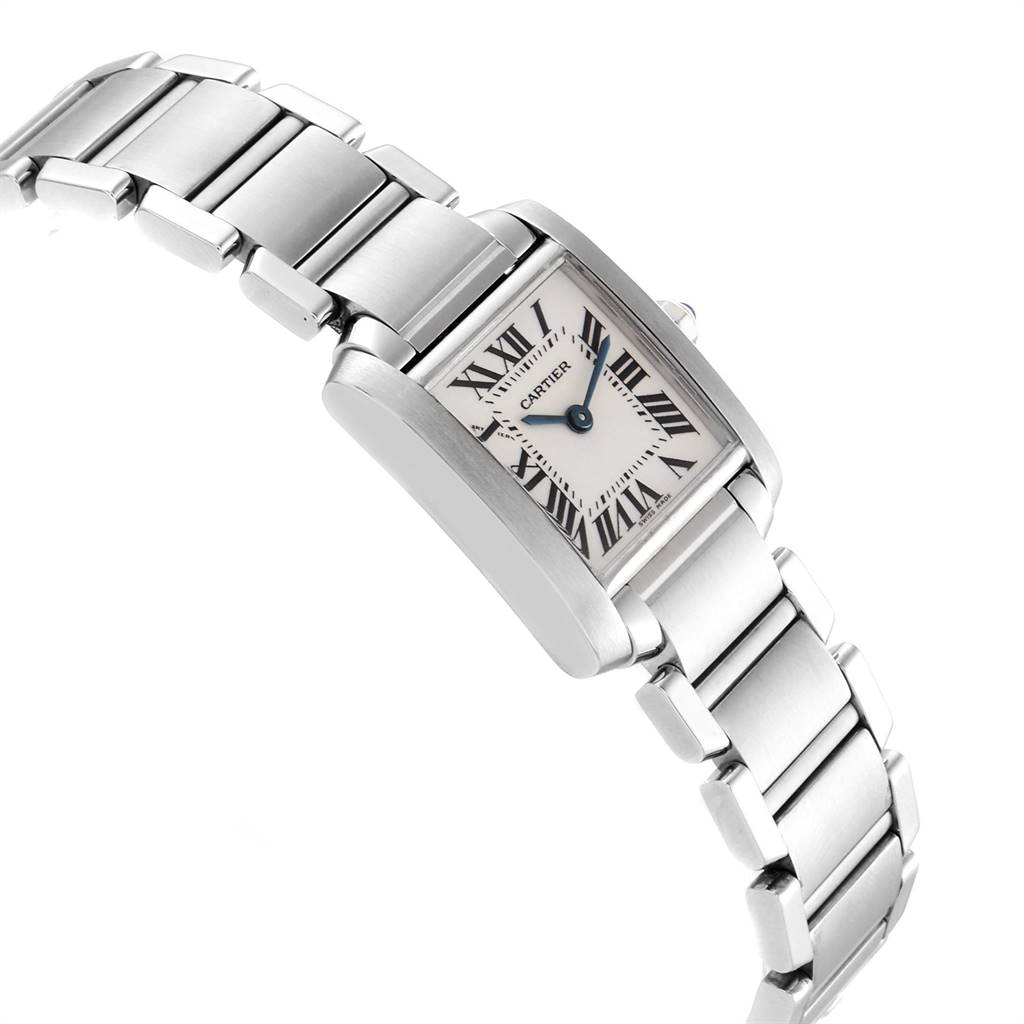 The image shows a Tank Française watch by Cartier, highlighting its square face, Roman numerals, and metal bracelet at a tilted angle.
