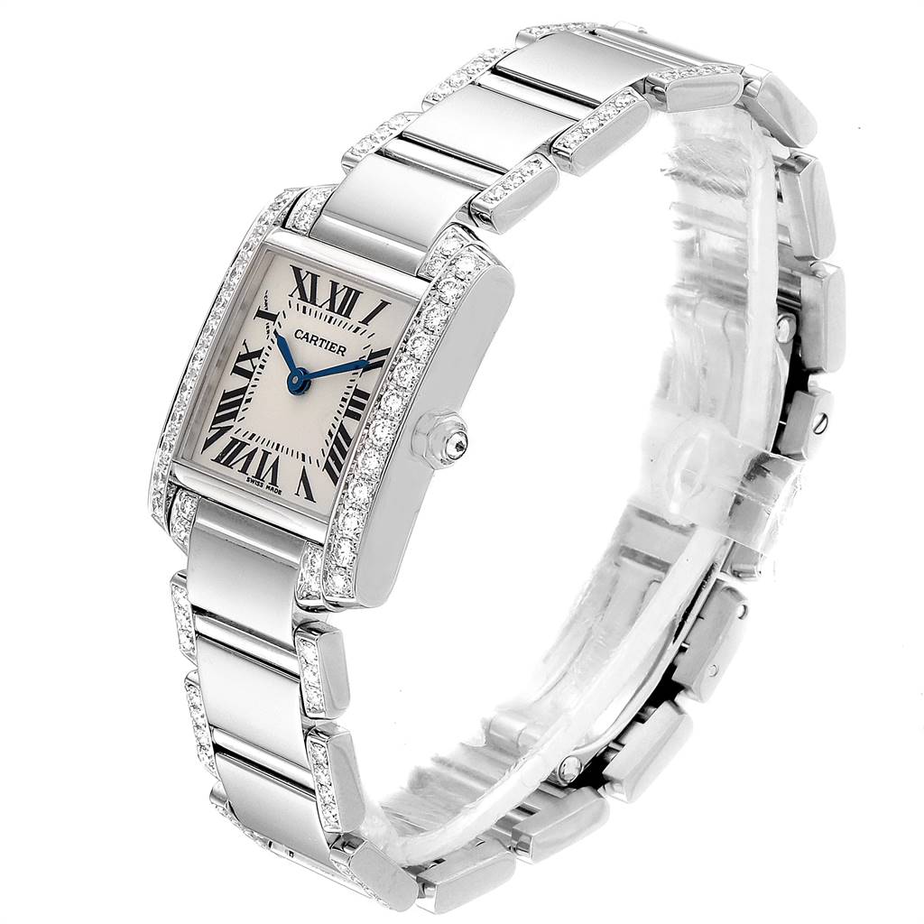 The image shows an angled view of a Cartier Tank Francaise WE1002SF Women
s White Gold Silver Dial WE1002SF Women
s White Gold Silver Dial watch, highlighting its rectangular face, bracelet, and diamond accents.