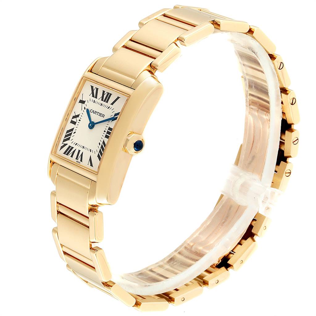 This image shows the Cartier Tank Française watch at a slight angle, highlighting its rectangular face, metal bracelet, and blue spinel cabochon crown.