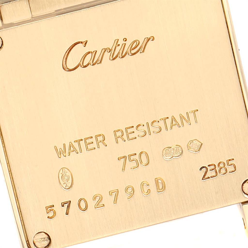This image shows the back of a Cartier Tank Francaise W50002N2 Women's Yellow Gold Silver Dial W50002N2 Women's Yellow Gold Silver Dial watch, displaying the brand name, model details, and water resistance.